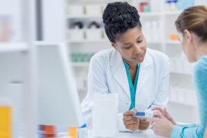 Pharmacist and patient discussion