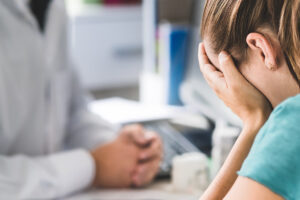 Pharmacist consulting distraught patient