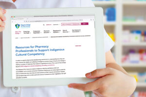 Pharmacist with Indigenous Resources page on tablet screen
