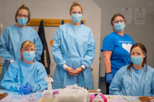 Photos of Pharmacy Technicians wearing PPE