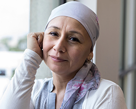 woman with cancer scarf on head