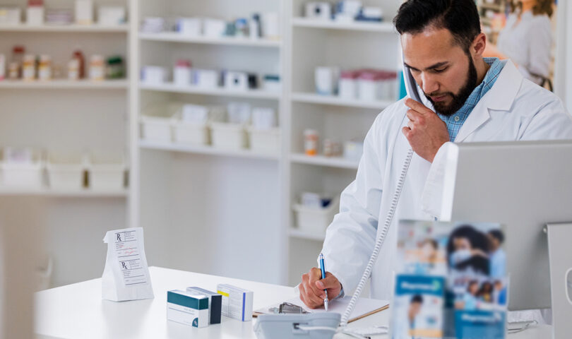 Pharmacist checking a prescription